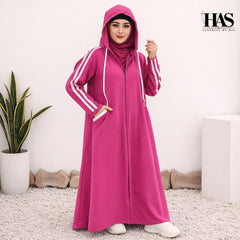 A woman is wearing a modest, sporty-style long outer garment in a deep color.